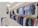 Walk-in closet showcasing well-organized clothing racks, shelves, and ample storage space at 3400 S Whetstone Pl, Chandler, AZ 85286