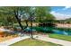 Scenic walking path along the lake, with lush landscaping and peaceful views, perfect for leisurely strolls at 3400 S Whetstone Pl, Chandler, AZ 85286