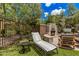 Pool-side fireplace and lounge area surrounded by manicured landscaping at 3900 E Baseline Rd # 137, Phoenix, AZ 85042
