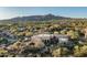 Panoramic aerial view showcasing the expansive property with mature landscaping and mountain backdrop at 40039 N 107Th Pl, Scottsdale, AZ 85262
