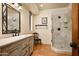 Well-appointed bathroom featuring a walk-in shower, neutral finishes and a decorative vanity at 40039 N 107Th Pl, Scottsdale, AZ 85262