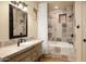 Beautiful bathroom with stone countertop vanity, tub-shower combo, and decorative tile at 40039 N 107Th Pl, Scottsdale, AZ 85262
