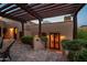 Charming courtyard with lush greenery, brick flooring, and a covered pergola provides a relaxing outdoor space at 40039 N 107Th Pl, Scottsdale, AZ 85262