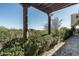 Open-air courtyard offering a private outdoor space with views of lush greenery and distant homes at 40039 N 107Th Pl, Scottsdale, AZ 85262
