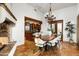 Dining room features a large table, fireplace and access to the patio at 40039 N 107Th Pl, Scottsdale, AZ 85262