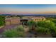 Expansive home boasts an attractive tile roof, lush landscape, and a brick driveway leading to a spacious two-car garage at 40039 N 107Th Pl, Scottsdale, AZ 85262