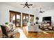 Bright living room with terracotta flooring, ample seating, and outdoor views at 40039 N 107Th Pl, Scottsdale, AZ 85262