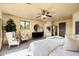 Bright and airy main bedroom boasts ample space, neutral tones, and a cozy seating area at 40039 N 107Th Pl, Scottsdale, AZ 85262