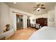 Spacious main bedroom features a fireplace, french doors, and terracotta tile floors at 40039 N 107Th Pl, Scottsdale, AZ 85262
