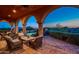 Enjoy outdoor relaxation on this expansive patio with comfortable wicker furniture, tile floors, and breathtaking mountain views at 40039 N 107Th Pl, Scottsdale, AZ 85262