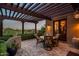 Inviting outdoor patio with a pergola, comfortable seating, and lush landscaping, perfect for relaxing at 40039 N 107Th Pl, Scottsdale, AZ 85262