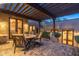 Covered patio with brick flooring features a dining area and easy access to the interior at 40039 N 107Th Pl, Scottsdale, AZ 85262
