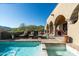 Inviting pool area with comfortable lounge chairs and a spa with views of the natural landscape at 40039 N 107Th Pl, Scottsdale, AZ 85262