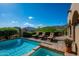 Backyard pool with lounge chairs, tiled deck, a view, privacy landscaping, and a convenient spa at 40039 N 107Th Pl, Scottsdale, AZ 85262