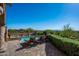 Luxurious pool area with spa, lounge chairs, and stunning hillside views at 40039 N 107Th Pl, Scottsdale, AZ 85262