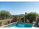 Sparkling pool offers refreshing escape amidst a backdrop of scenic mountain views and greenery at 40039 N 107Th Pl, Scottsdale, AZ 85262