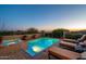 Outdoor living space features a pool, a tanning deck, lounge chairs, tiled decking, and spectacular sunset views at 40039 N 107Th Pl, Scottsdale, AZ 85262