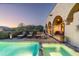 Inviting swimming pool and spa overlooks the scenic desert landscape, providing a perfect retreat for relaxation at 40039 N 107Th Pl, Scottsdale, AZ 85262