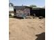 Backyard showing a tarped shed or construction project and debris at 4233 E Minton St, Phoenix, AZ 85042