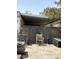 Exterior of the home with an enclosed patio and a partially covered area at 4233 E Minton St, Phoenix, AZ 85042