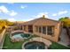 Stunning aerial view of home, pool and spa combo, with a lovely backyard perfect for entertaining or relaxing at 4281 S Tecoma Trl, Gold Canyon, AZ 85118