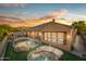 Gorgeous backyard with pool, spa, and lovely sunset at 4281 S Tecoma Trl, Gold Canyon, AZ 85118