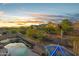 Desert backyard offers mountain views, pool, spa, and stained glass structure at 4281 S Tecoma Trl, Gold Canyon, AZ 85118