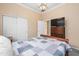 Cozy bedroom with a comfortable bed, closet and a dresser with mounted TV at 4281 S Tecoma Trl, Gold Canyon, AZ 85118