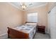 Cozy bedroom featuring a comfortable bed, nightstand, and a closet for storage at 4281 S Tecoma Trl, Gold Canyon, AZ 85118