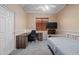Bedroom with desk, ceiling fan, and carpeted floors at 4281 S Tecoma Trl, Gold Canyon, AZ 85118