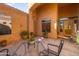 Charming courtyard with potted plants, outdoor seating, and architectural elements at 4281 S Tecoma Trl, Gold Canyon, AZ 85118