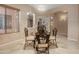 Elegant dining area with chandelier lighting and seating for four at 4281 S Tecoma Trl, Gold Canyon, AZ 85118