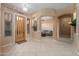 Inviting foyer with tile flooring, archways leading to living spaces, and a glimpse of the entryway at 4281 S Tecoma Trl, Gold Canyon, AZ 85118