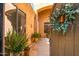 View through front gate to a charming walkway and front door at 4281 S Tecoma Trl, Gold Canyon, AZ 85118