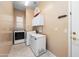 Functional laundry room with modern appliances and extra storage at 4281 S Tecoma Trl, Gold Canyon, AZ 85118