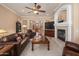 Spacious living room with a fireplace, large TV, and comfortable seating at 4281 S Tecoma Trl, Gold Canyon, AZ 85118