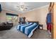 Spacious main bedroom with a ceiling fan, built-in wardrobe, and comfortable lounge area at 4281 S Tecoma Trl, Gold Canyon, AZ 85118