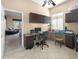 Functional home office features dual desks, storage cabinets and tiled floors at 4281 S Tecoma Trl, Gold Canyon, AZ 85118