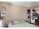Bedroom with hardwood flooring, closet, and decorative vanity at 4434 E Wood St, Phoenix, AZ 85040