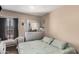 Bedroom with hardwood flooring, ceiling fan, and dresser at 4434 E Wood St, Phoenix, AZ 85040