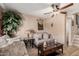 Cozy living room featuring comfortable seating, a ceiling fan, and neutral decor at 4434 E Wood St, Phoenix, AZ 85040