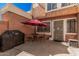 Inviting patio area with a table, chairs, and grill, perfect for outdoor dining at 4434 E Wood St, Phoenix, AZ 85040