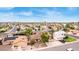 Charming single-Gathering home featuring a lush front yard, driveway, and solar panels in a peaceful residential neighborhood at 4510 W North Ln, Glendale, AZ 85302