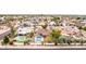 Bird's-eye view of the neighborhood highlighting a swimming pool and well-maintained lawns surrounded by mature landscaping at 4510 W North Ln, Glendale, AZ 85302