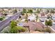 Stunning aerial view of a home showcasing two sparkling pools and lush landscaping in a desirable neighborhood setting at 4510 W North Ln, Glendale, AZ 85302