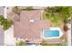Aerial view of the home displaying the roof and backyard pool with covered patio and landscaping at 4510 W North Ln, Glendale, AZ 85302