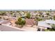 A bird's eye view showcases a swimming pool along with the neighborhood streets and other homes at 4510 W North Ln, Glendale, AZ 85302