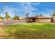 A lovely backyard shows off the covered patio, fenced pool, and verdant landscaping at 4510 W North Ln, Glendale, AZ 85302
