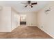 Bedroom features neutral walls and ceiling fan with a view of an ensuite bathroom at 4510 W North Ln, Glendale, AZ 85302