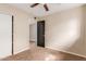 Bedroom featuring carpet, a ceiling fan, and closet at 4510 W North Ln, Glendale, AZ 85302